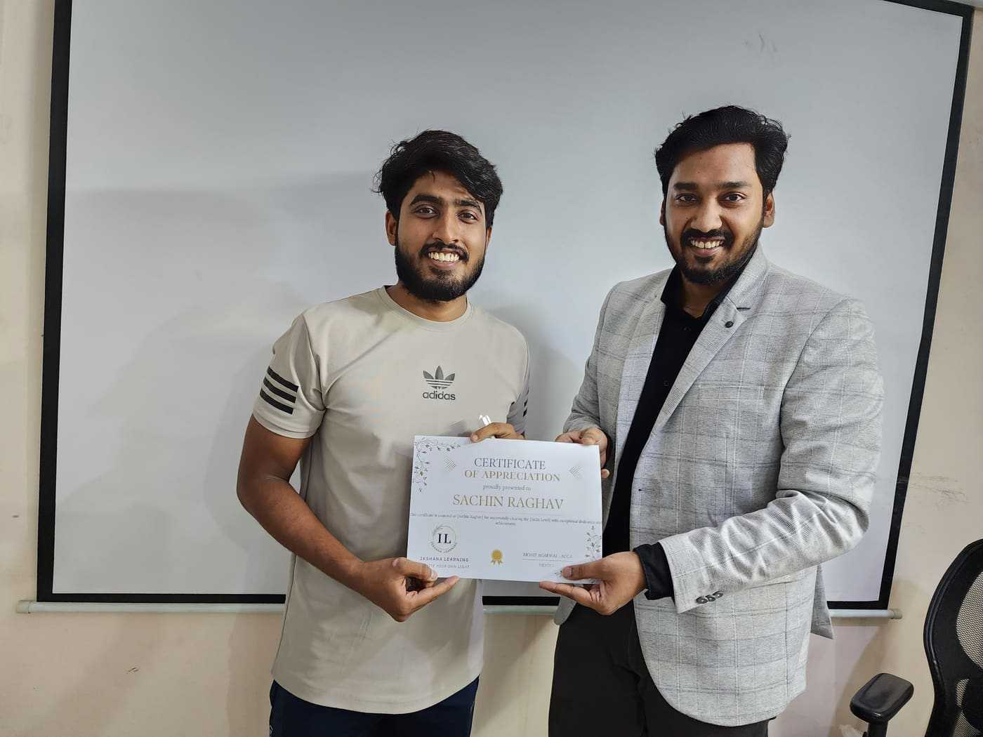 Sachin Raghav receiving ACCA Skill Level certificate from Mohit Agarwal